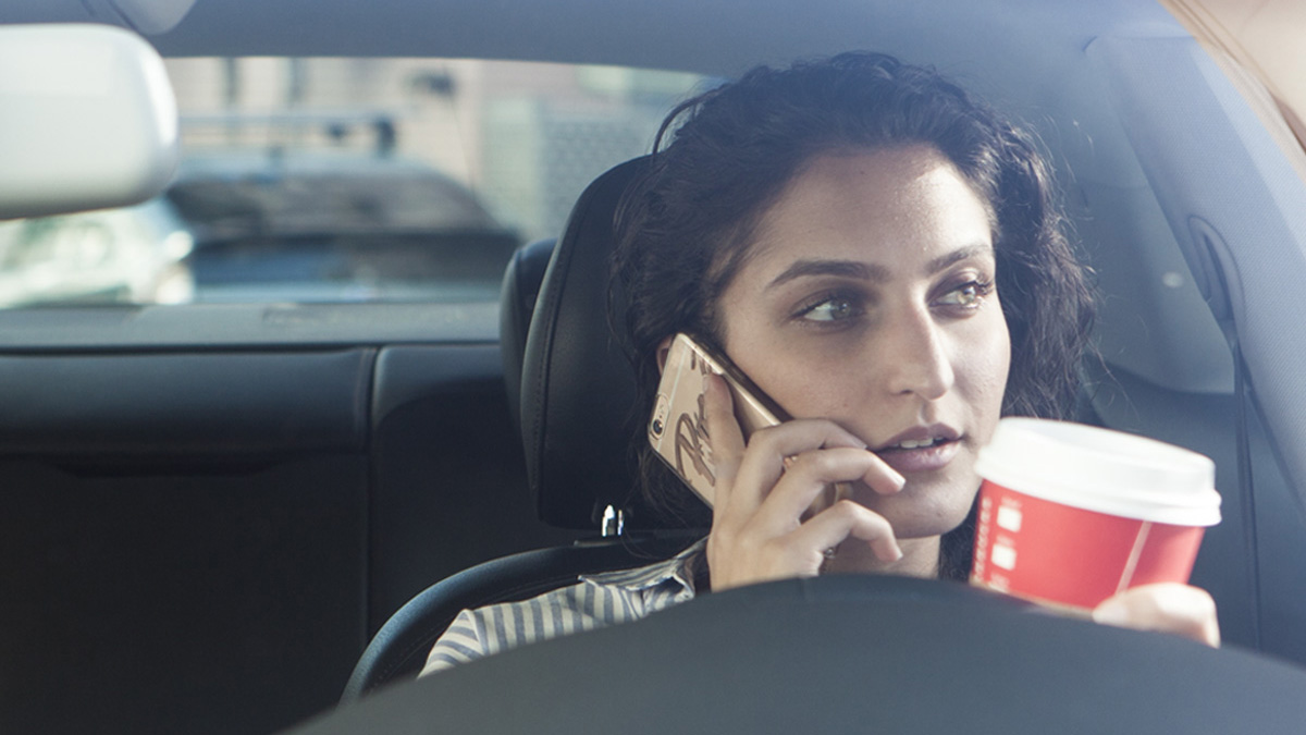 is_hands_free_hassle_free_woman_with_cell_phone_in_car-TrueCar_pricing