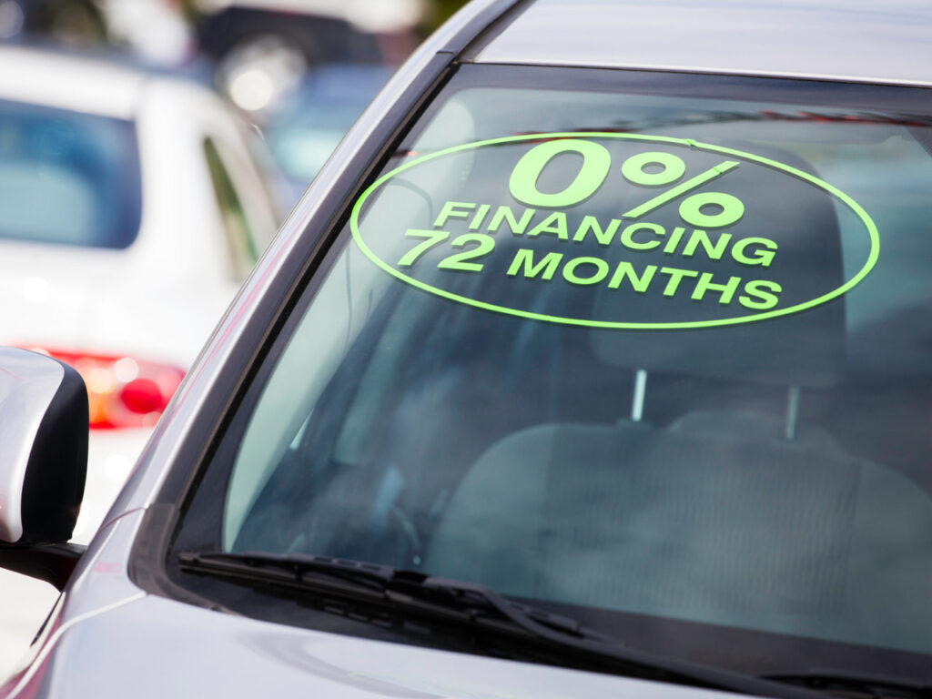 Message on a car windshield that reads 0% financing for 72 months.