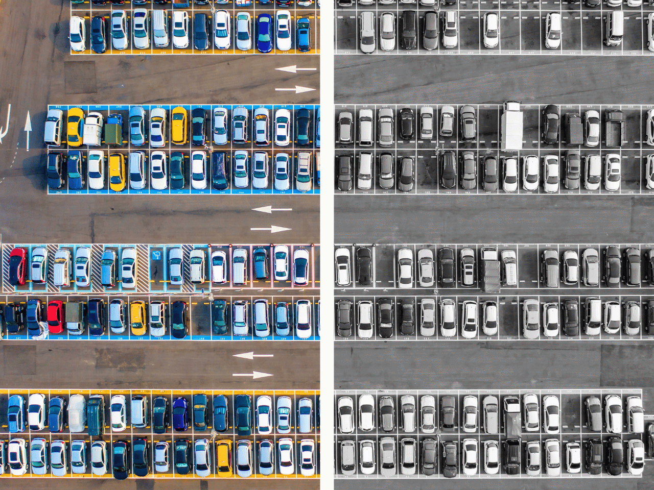 Aerial shot of parking lot showing colorful cars and achromatic cars